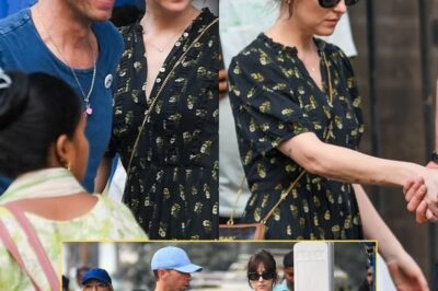 Dakota Johnson and Chris Martin hold hands on a romantic stroll through the hustle and bustle of Mumbai